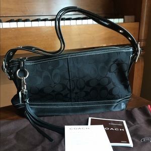 All black Coach shoulder bag.